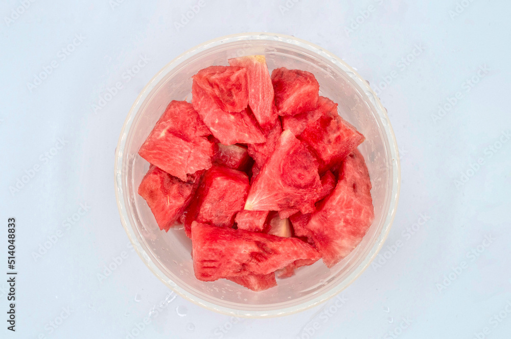 TOP VIEW OF FRESH SEEDLESS WATERMELON IN PIECES INSIDE A PLASTIC LUNCH BOX TOP VIEW OF FRESH SEEDLESS WATERMELON IN PIECES INSIDE A PLASTIC LUNCH BOX