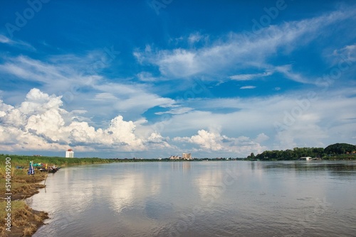 Fototapeta Naklejka Na Ścianę i Meble -  Beautiful time. View of Mekong River Vientiane, Laos. fisher men, boat on mekong, background city