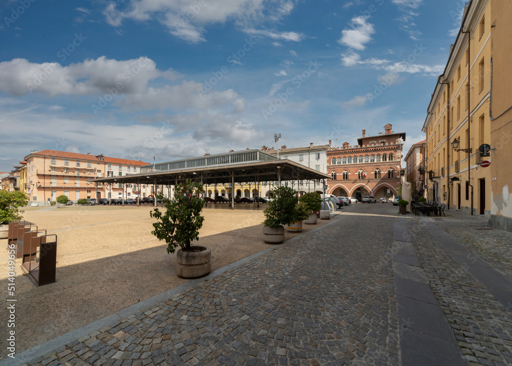 Cuneo, Italy, - June 27, 2022: piazza Vincenzo Virginio, former wine market square, with covered fruit and vegetable market, metal canopy from 1934 (eng Cesare Vinaj)