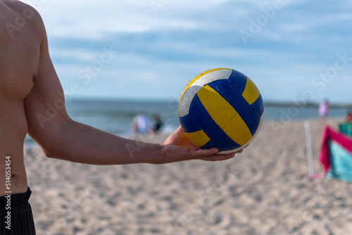 playing volleyball on the beach