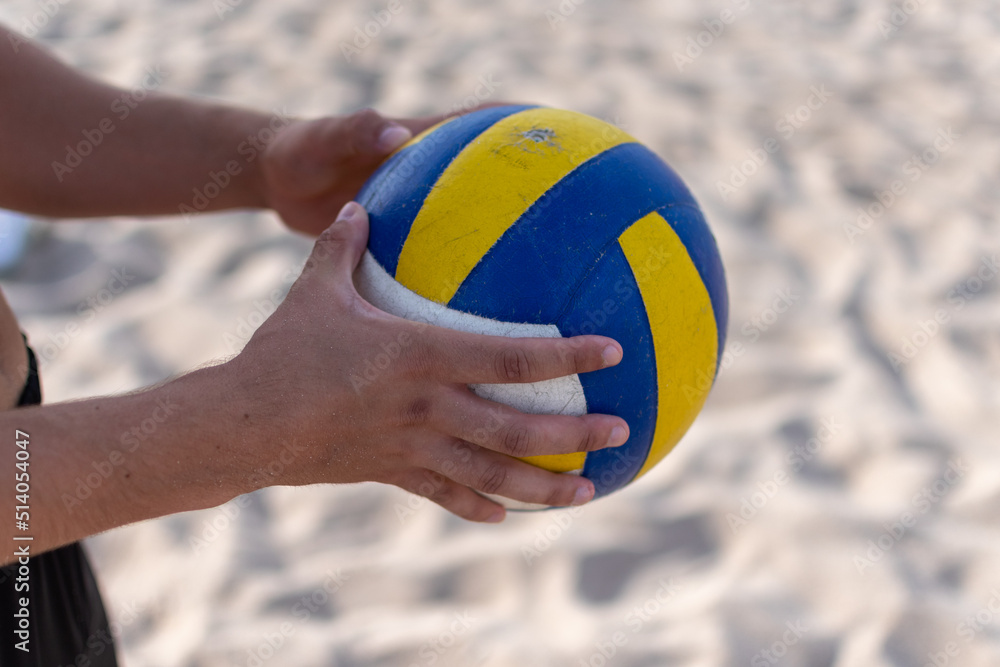 playing volleyball on the beach