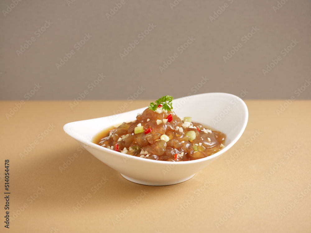 marinated jellyfish with vinaigrette served in a dish isolated on background side view marinated jellyfish with vinaigrette served in a dish isolated on background side view