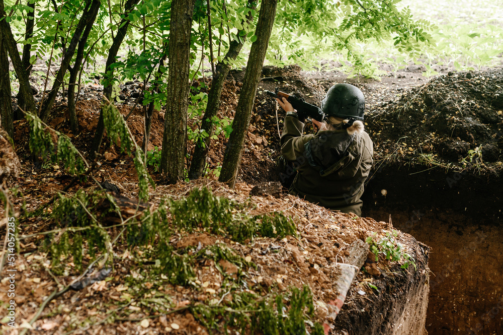 Soldier in a trench on the front line of the Ukrainian-Russian war, defense of Ukrainian borders from orcs.