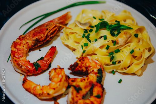 Pasta with shrimps and langustine. Seafood. Home cooking. photo