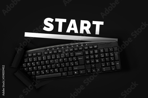 PC keyboard with word Start on black background 