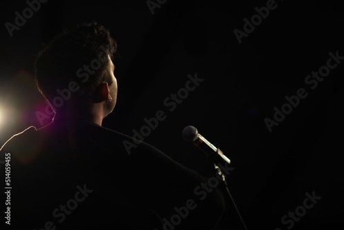 Musician singing on a stage