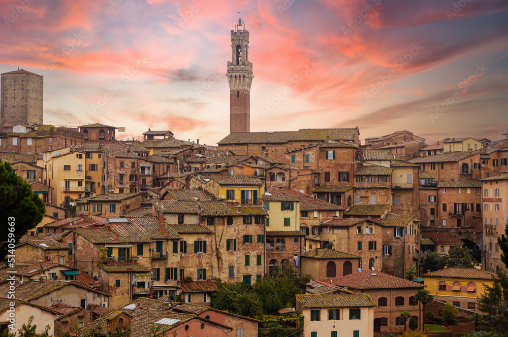 Beautiful Siena view of Tuscany, Italy. Palazzo Pubblico with Italian brick houses.