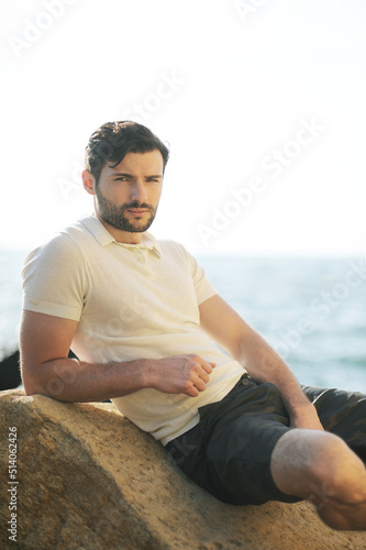 Young stylish smiling man dressed in polo shirt