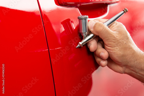 Professional micro paint on an automobile using an airbrush