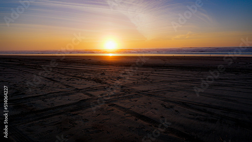 Sunset over Pacific Ocean  as seen from a beach on the Oregon coast