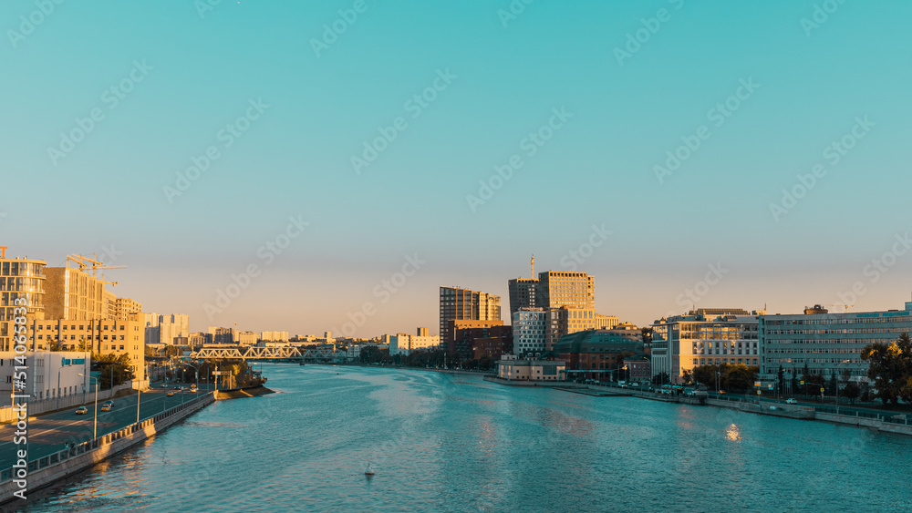 Fototapeta premium Modern city skyline and buildings in Moscow. View from Avtozavodskiy Bridge on Novodanilovskaya Naberezhnaya and Prospekt Likhachova