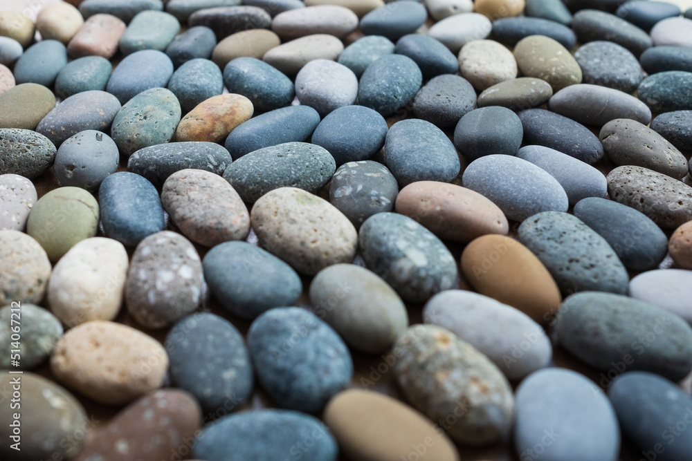 Colored blue and yellow sea stones background. Top view Colored blue and yellow sea stones background. Top view