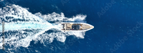 Aerial drone photo of  luxury inflatable rib speed boat cruising in mediterranean deep blue sea photo