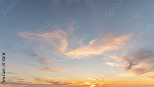 abstract background of cloudy sunset sky golden hour photo