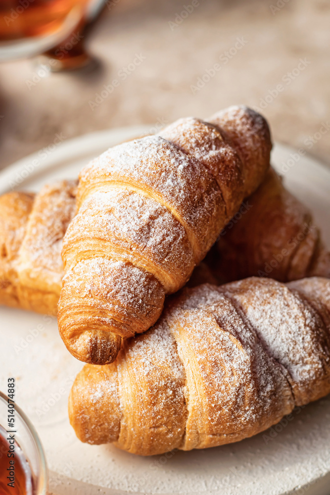 Fresh croissants for breakfast on brown background close up Fresh croissants for breakfast on brown background close up