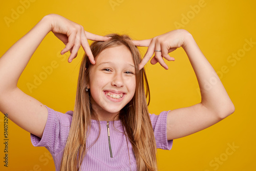 Canvas Print Playful young girl grimacing at camera close-up horizontal website header banner