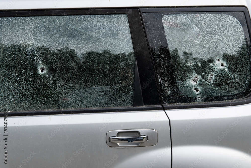 Obraz premium Criminal incident. Car burglary. Broken left side window of a car.