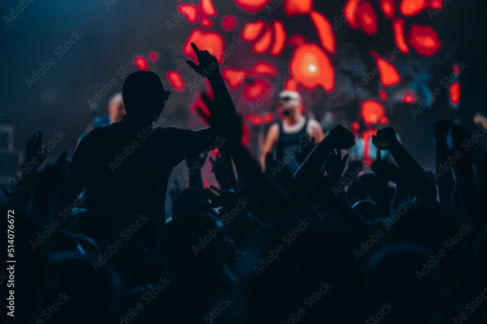 Man in a concert audience having fun on a music festival