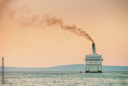 Summer seascape with sunset view - the ship leaves port for the open sea, port of Split on the Adriatic coast of Croatia