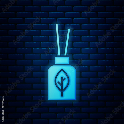 Glowing neon Aroma diffuser icon isolated on brick wall background. Glass jar different with wooden aroma sticks. Vector