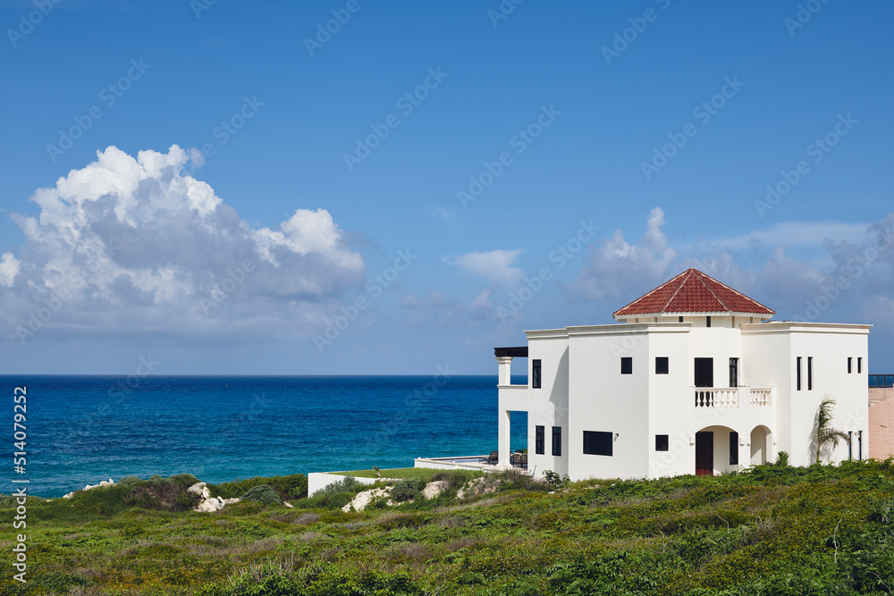 A modern home on the shore of the ocean