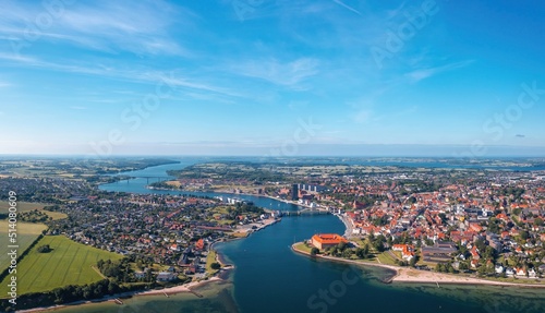 Sonderborg (Sønderborg, Denmark) skyline on sunny summer day. Wide aerial panorama