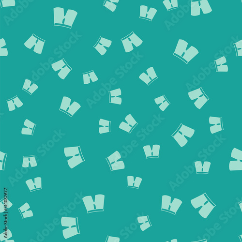 Green Short or pants icon isolated seamless pattern on green background. Vector