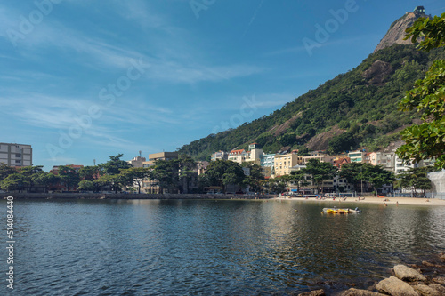 Bairro Urca Rio beach sea bay city quiet life tree urban suburb street path sidewalk asphalt car boat horizon landscape hill mountain cliff people short wall neighborhood