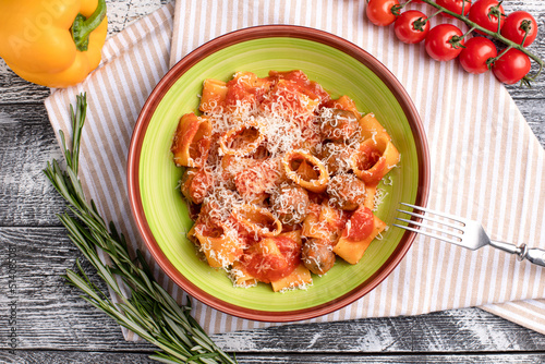 Pasta with meat balls, pasta with tomatoes and meat on a white wooden background, top view