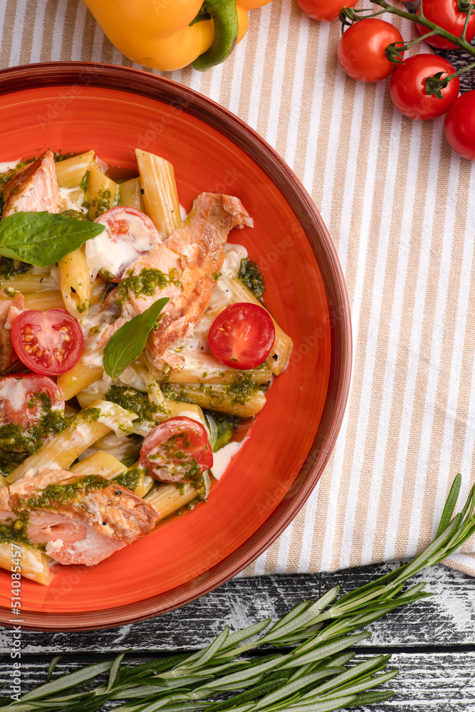 Pasta with salmon, pasta with fish on a white wooden background, top view Pasta with salmon, pasta with fish on a white wooden background, top view