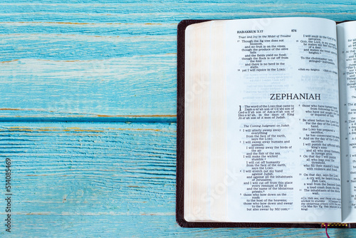 Canvas Print Zephaniah open Holy Bible Book on a rustic wooden background with copy space