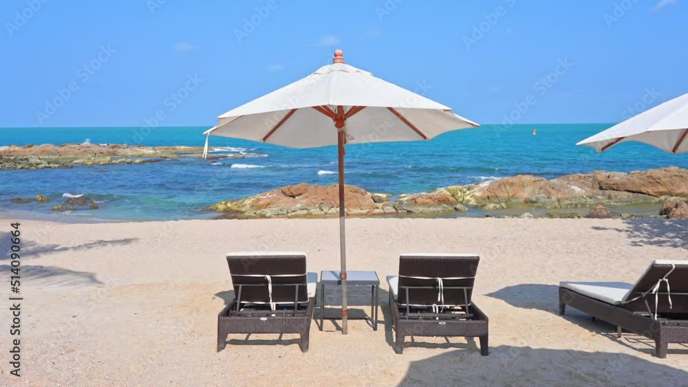 Tropical Holiday Concept, Sunbeds and Parasols on Beach With Horizon View Tropical Holiday Concept, Sunbeds and Parasols on Beach With Horizon View