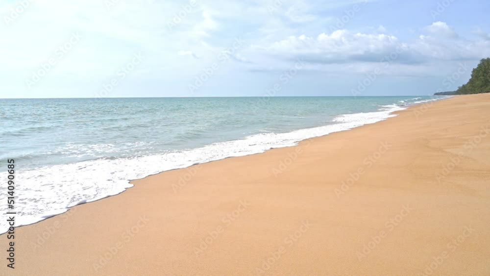 Soft Wet Sandy Beach with Crashing Waves Rolling Over the Tropical Island Coast Soft Wet Sandy Beach with Crashing Waves Rolling Over the Tropical Island Coast