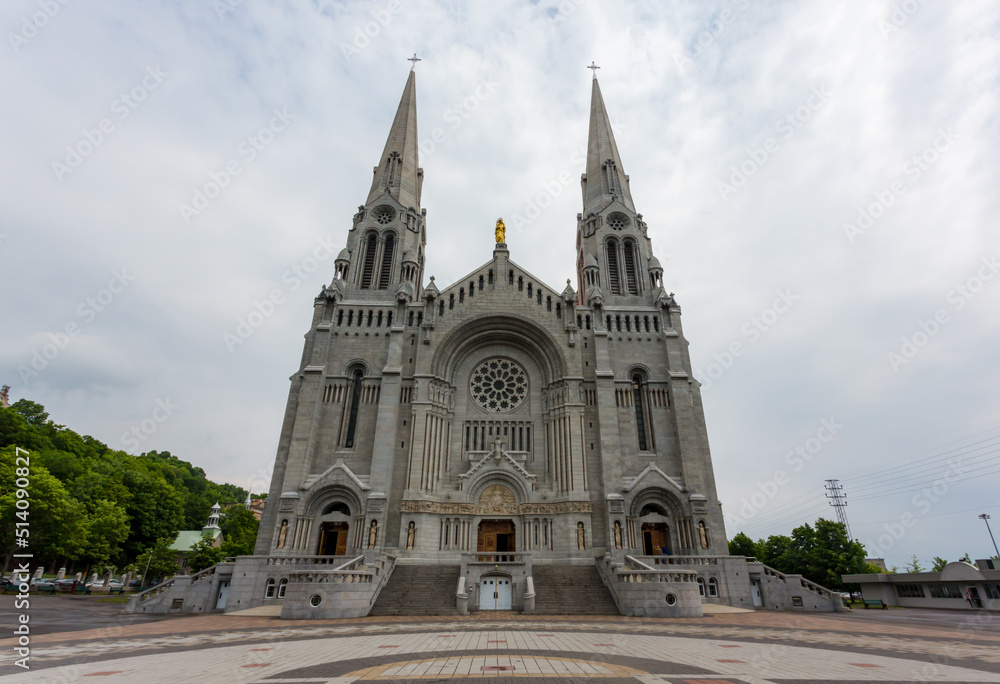 Beautiful fountain in front of the majestic Basilica of Sainte-Anne-de-Beaupre, Cathedral, Quebec an important Catholic sanctuary.