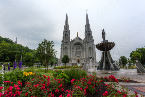 Beautiful fountain in front of the majestic Basilica of Sainte-Anne-de-Beaupre, Cathedral, Quebec an important Catholic sanctuary.