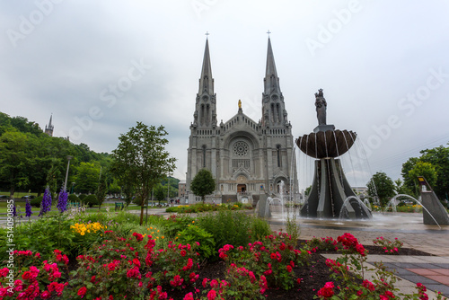 Beautiful fountain in front of the majestic Basilica of Sainte-Anne-de-Beaupre, Cathedral, Quebec an important Catholic sanctuary. photo