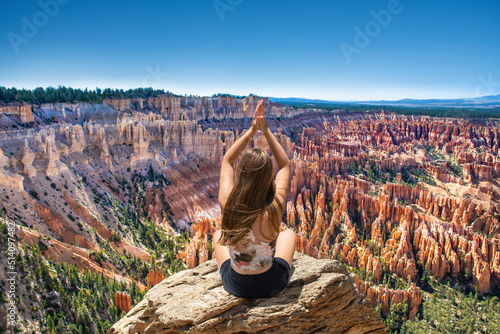 Fotografering Girl practicing yoga in nature