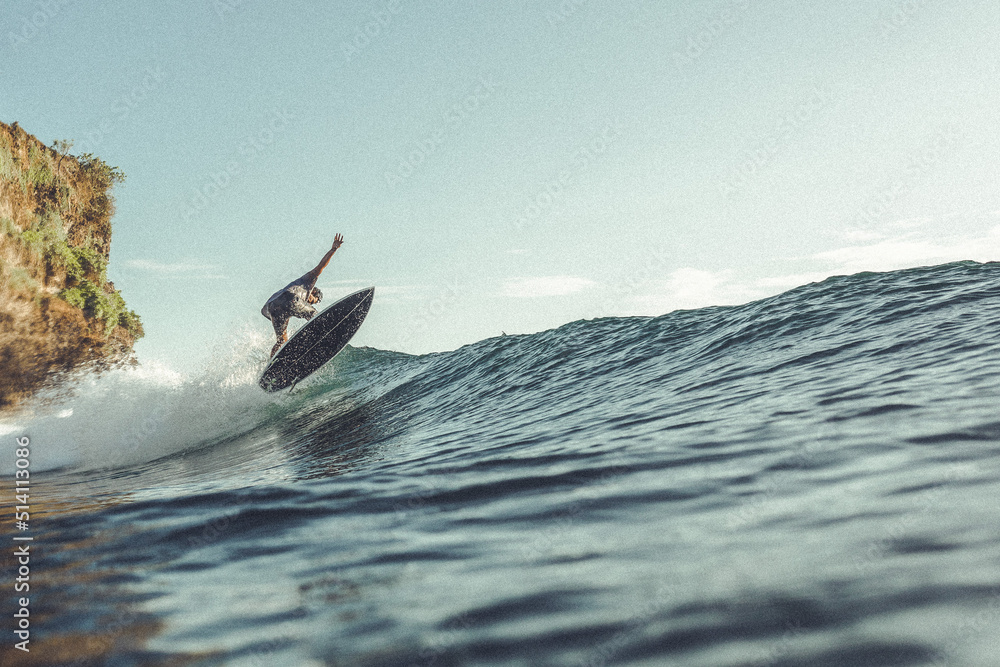 Surfer doing air at Balangan Beach