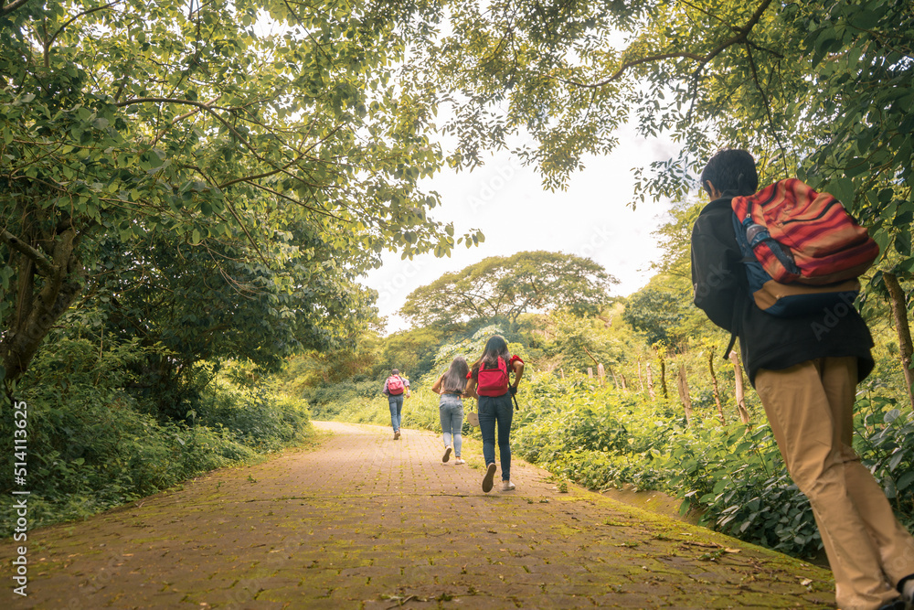 Obraz premium Group of university students traveling to their campus in a mountainous area in Jinotega Nicaragua