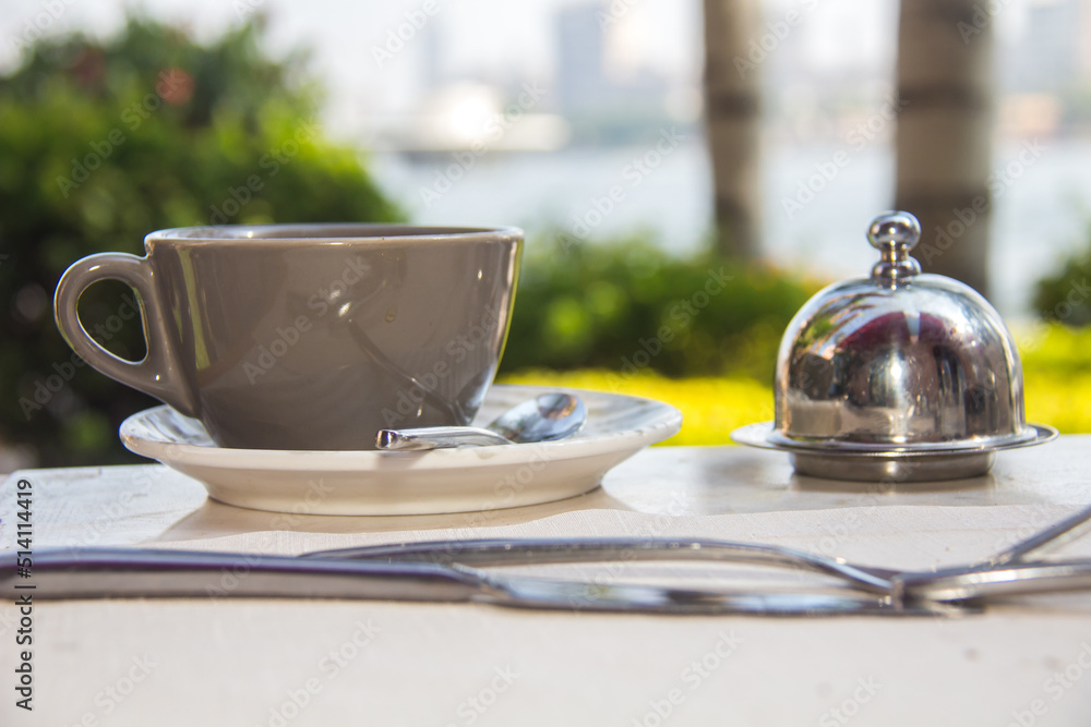 Fototapeta premium Cup of Coffee Nile view, shot is selective focus with shallow depth of field. Photos taken at Cairo Egypt