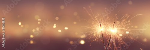 Fototapeta Naklejka Na Ścianę i Meble -  Happy New Year background with glowing sparklers.
