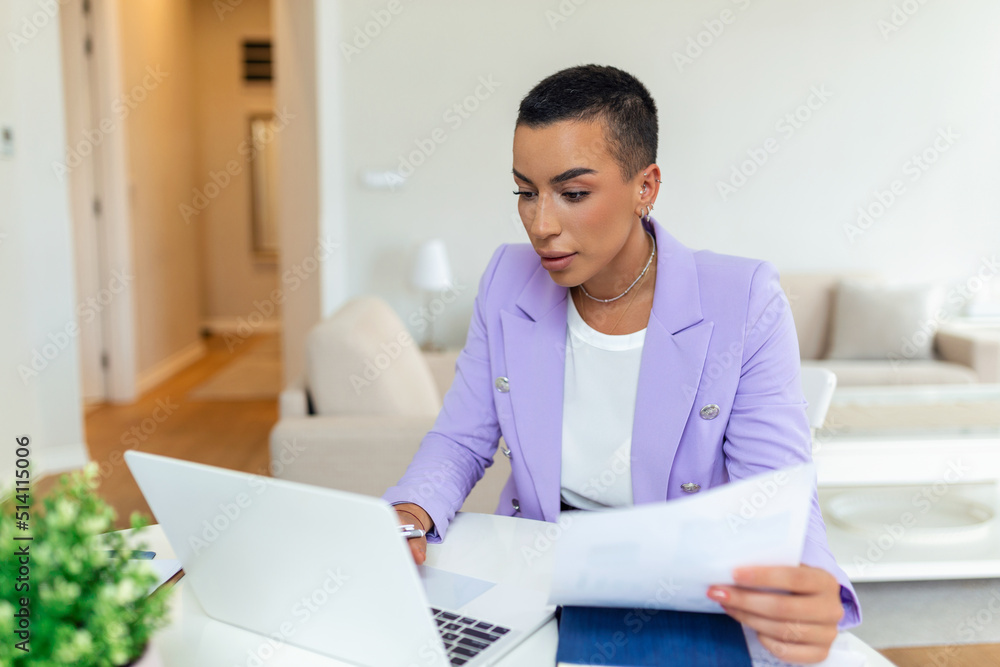 Beautiful African American woman freelancer noting information for planning project doing remote job via laptop computer. woman laughing while reading email on modern laptop device . Beautiful African American woman freelancer noting information for planning project doing remote job via laptop computer. woman laughing while reading email on modern laptop device .