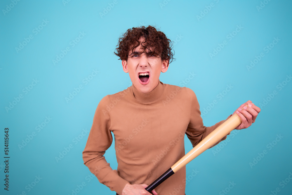 Young attractive guy with a bat. Young attractive guy with a bat.