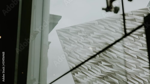 View of Titanic Museum Belfast through window, overcast day photo