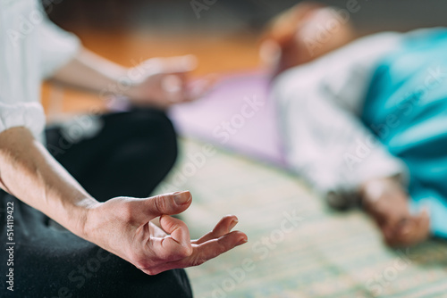 Senior woman on a guided meditation class