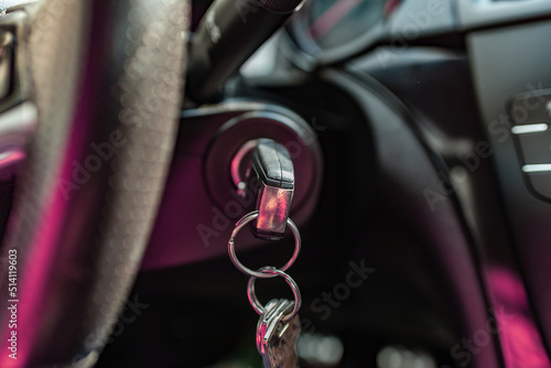 Photography Key inserted into the lock of ignition of the car