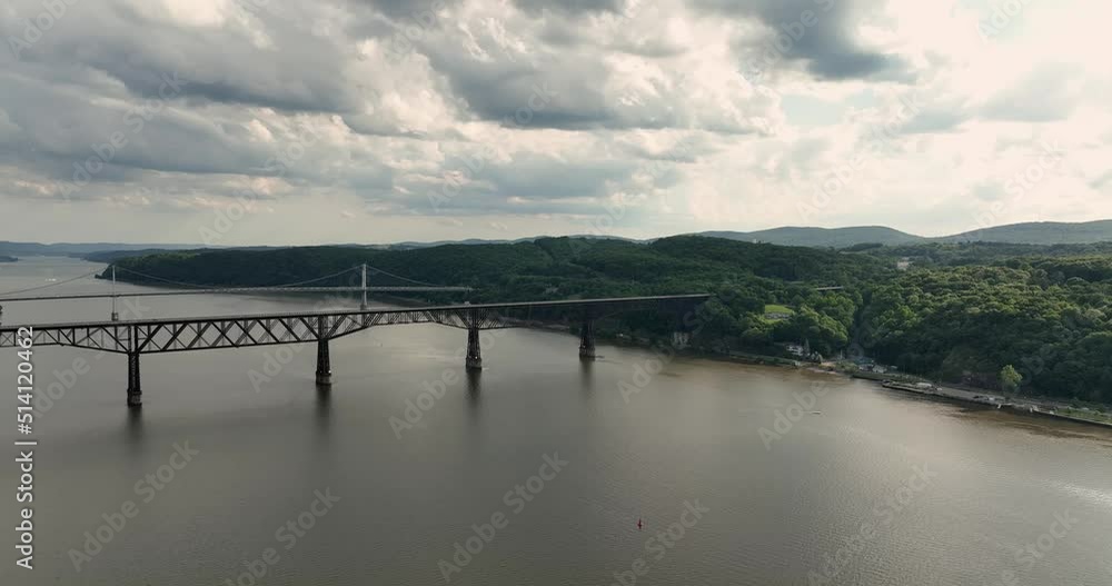 Summer afternoon aerial drone video of the Hudson River, Poughkeepsie, NY, walking bridge and Mid-Hudson Bridge of the Hudson River.. Summer afternoon aerial drone video of the Hudson River, Poughkeepsie, NY, walking bridge and Mid-Hudson Bridge of the Hudson River..