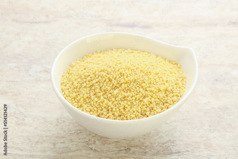 Raw couscous in the bowl Raw couscous in the bowl