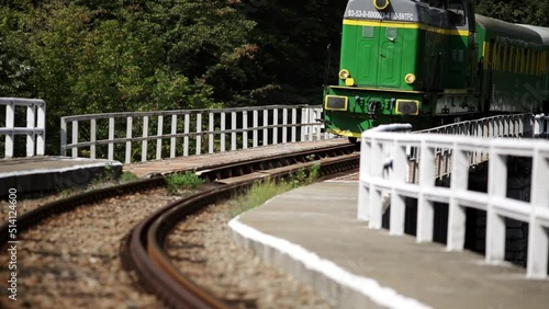 Diesel locomotive crosses the feroviar bridge photo