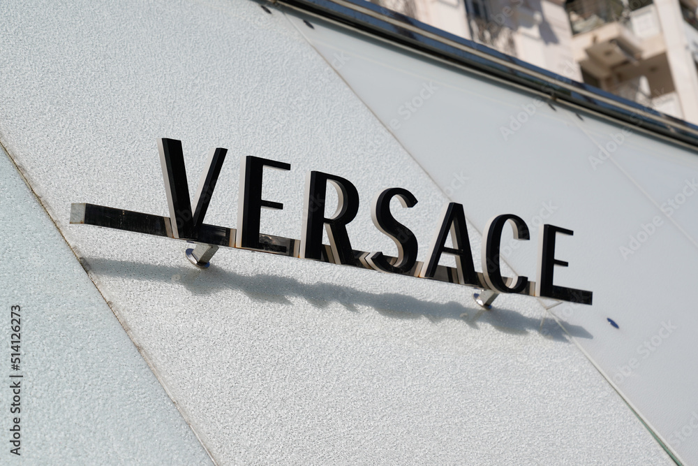 Versace logo text and sign wall of shop Italian fashion brand store company  founded by Gianni Versace Stock Photo | Adobe Stock